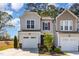 Charming home featuring a welcoming facade, landscaped yard, and attached garage at 301 White Oak Ridge Dr, Garner, NC 27529