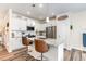 Modern kitchen featuring white cabinetry, stainless steel appliances, and a breakfast bar at 301 White Oak Ridge Dr, Garner, NC 27529