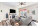 Cozy living room features a comfortable gray sofa, decorative accents, and a view to the private backyard at 301 White Oak Ridge Dr, Garner, NC 27529