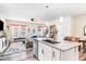 Open-concept living room view showcases the kitchen island and a comfortable seating area with ample natural light at 301 White Oak Ridge Dr, Garner, NC 27529