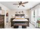 Comfortable main bedroom with ceiling fan, large window, and decorative accents for a cozy retreat at 301 White Oak Ridge Dr, Garner, NC 27529