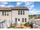 Rear exterior features a cozy patio with seating in fenced yard and ample natural light at 301 White Oak Ridge Dr, Garner, NC 27529