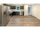 Well-lit kitchen with stainless steel appliances, dark cabinetry, and a granite countertop at 32 Bellini Dr, Angier, NC 27501
