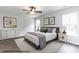 Bright and airy bedroom with hardwood floors, two windows, and neutral décor at 322 Bluejay St, Clayton, NC 27520