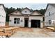 New construction featuring a charming one-story home with an attached garage and gravel driveway at 330 Bluejay St, Clayton, NC 27520