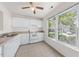 Bright kitchen with white cabinetry, neutral countertops, and ample natural light for comfortable cooking at 359 Kilarney Dr, Durham, NC 27703