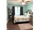 Bedroom featuring a large window with plenty of natural light and an area rug on the wood-look floor at 4159 Princeton Kenly Road, Kenly, NC 27542