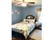 Bedroom featuring a bed with patterned linens and a side table at 4159 Princeton Kenly Road, Kenly, NC 27542
