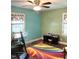 Bedroom featuring two large windows and a ceiling fan at 4159 Princeton Kenly Road, Kenly, NC 27542