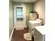 Functional laundry room with a washer, dryer, exterior door, and ample storage space at 4159 Princeton Kenly Road, Kenly, NC 27542
