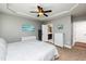 Bright bedroom with en-suite bathroom access, neutral decor, and tray ceiling at 4290 Sustain Cir, Franklinton, NC 27525