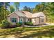 A single-story home with a welcoming porch and a well-manicured lawn at 4290 Sustain Cir, Franklinton, NC 27525
