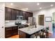 Bright kitchen featuring granite countertops, stainless steel appliances, and a central island at 4290 Sustain Cir, Franklinton, NC 27525