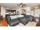 Open concept living area with a sectional sofa, connecting to the kitchen with barstool seating at 4290 Sustain Cir, Franklinton, NC 27525