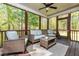 Relaxing screened porch offers comfortable seating with a beautiful view of the surrounding woods at 4290 Sustain Cir, Franklinton, NC 27525