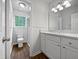Bright bathroom showcasing a vanity with drawers and a marble countertop, plus a glass door shower at 501 Gooseneck Dr # B6, Cary, NC 27513