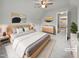 Staged bedroom with soft carpet, ceiling fan, and neutral tones at 501 Gooseneck Dr # B6, Cary, NC 27513