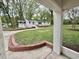 Spacious backyard featuring well-maintained lawn, brick accents, and white brick exterior at 508 & 510 Gordon St, Roxboro, NC 27573