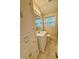 This bathroom features a single sink, vanity, tiled floors and a window at 508 & 510 Gordon St, Roxboro, NC 27573