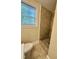 This bathroom features a tiled stand-up shower, tile flooring and a window at 508 & 510 Gordon St, Roxboro, NC 27573