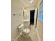 Cozy bathroom with neutral tiling, a large window, and a vanity and toilet at 508 & 510 Gordon St, Roxboro, NC 27573