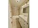 Bathroom features neutral tiling, a shower and tub combo, and vanity with mirror at 508 & 510 Gordon St, Roxboro, NC 27573