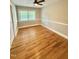 Bedroom with light colored walls, hardwood floors, trim, and natural light at 508 & 510 Gordon St, Roxboro, NC 27573