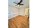 Spacious bedroom with beautiful hardwood floors and trim, and a ceiling fan providing comfort at 508 & 510 Gordon St, Roxboro, NC 27573