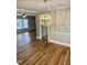 An open dining room with hardwood floors and decorative lighting, seamlessly connecting to other living spaces at 508 & 510 Gordon St, Roxboro, NC 27573