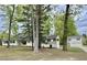 Charming single-story home featuring a covered porch, neutral paint, and mature trees at 508 & 510 Gordon St, Roxboro, NC 27573