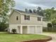 Charming home with a three-car garage and pristine landscaping, offering ample parking and curb appeal at 508 & 510 Gordon St, Roxboro, NC 27573