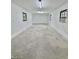 Bright garage interior with concrete floor, white walls, and natural light from windows at 508 & 510 Gordon St, Roxboro, NC 27573
