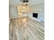 Bright living room features refinished wood-look floors and a brick fireplace at 508 & 510 Gordon St, Roxboro, NC 27573