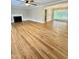 Bright and open living room with hardwood floors, fireplace, and natural light from a large window at 508 & 510 Gordon St, Roxboro, NC 27573