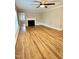 Cozy living room featuring hardwood floors, a fireplace, and natural light, offering a comfortable atmosphere at 508 & 510 Gordon St, Roxboro, NC 27573