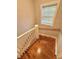 This home features a winding staircase with wooden stairs, white spindles and a wood handrail at 508 & 510 Gordon St, Roxboro, NC 27573