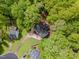 Overhead aerial view of a wooded lot and a home with a dark roof at 508 Baygall Rd, Holly Springs, NC 27540