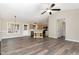 Open concept living room with hardwood floors that flows into the kitchen at 508 Baygall Rd, Holly Springs, NC 27540