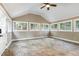 Bright sunroom with many windows and tile flooring at 508 Baygall Rd, Holly Springs, NC 27540