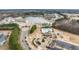 Aerial view of community amenities including a pool, playground, and clubhouse in a new neighborhood at 512 Oak Holly Ln, Zebulon, NC 27597