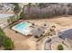 Overhead view of community pool, playground, clubhouse, and recreational areas in a residential community at 512 Oak Holly Ln, Zebulon, NC 27597