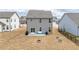 Large backyard with patio, furniture, and a fire pit, perfect for outdoor living at 512 Oak Holly Ln, Zebulon, NC 27597