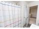 Bathroom featuring a shower with colorful curtain and bright lighting at 512 Oak Holly Ln, Zebulon, NC 27597