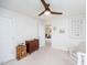 Cozy bedroom with wood furniture, a ceiling fan and a reading nook at 512 Oak Holly Ln, Zebulon, NC 27597