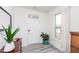 Bright entryway featuring wood-look flooring, a decorative table, and a view of the front door at 512 Oak Holly Ln, Zebulon, NC 27597