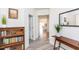 Inviting hallway with wood-look flooring, leading to living areas, and a decorative bookcase at 512 Oak Holly Ln, Zebulon, NC 27597