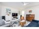 Stylish living room with built-in shelving, modern decor, wood-look floors, and plenty of natural light at 512 Oak Holly Ln, Zebulon, NC 27597