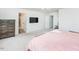 Large bedroom features a ceiling fan, natural light, and ensuite bathroom at 512 Oak Holly Ln, Zebulon, NC 27597