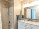 Bathroom featuring shower over tub, a vanity with marble countertop and ample lighting at 519 Touchstone Dr, Durham, NC 27713