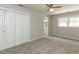 Spacious bedroom with carpet, ensuite bathroom, ceiling fan and large closet, awaiting your personal design touch at 519 Touchstone Dr, Durham, NC 27713